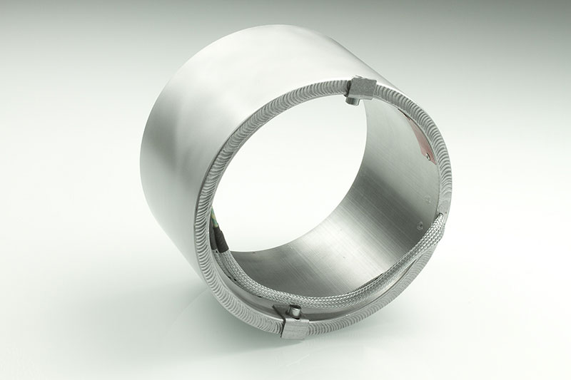 collier chauffant, pour températures jusqu'à 450 ° C, moulage par injection, extrusion, conception écoénergétique, flux thermique homogène, alésages, évidements, thermocouple intégré, système conforme au contour