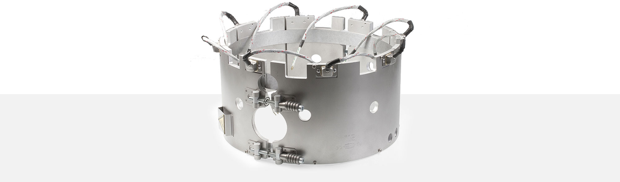 collier chauffant, pour températures jusqu'à 450 ° C, moulage par injection, extrusion, conception écoénergétique, flux thermique homogène, alésages, évidements, thermocouple intégré, système conforme au contour
